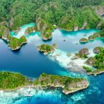 an aerial view of an island in the middle of the ocean