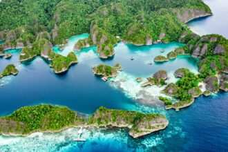 an aerial view of an island in the middle of the ocean