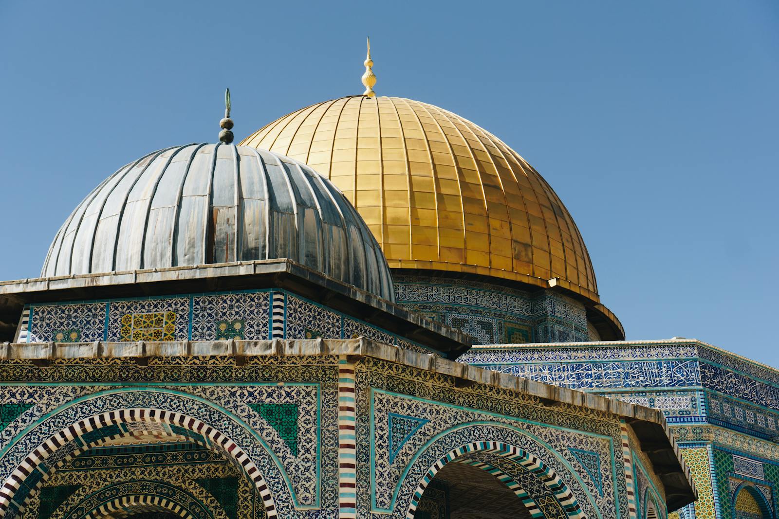 Brightly detailed capture of the iconic Dome of the Rock in Jerusalem, showcasing intricate Islamic architecture.
